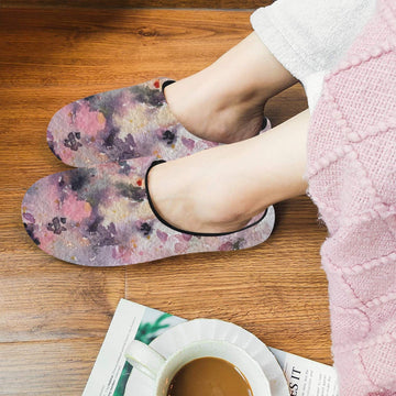 Women's Rose wave black cotton non-slip slippers with plush lining and TPR sole, worn indoors on wooden floor