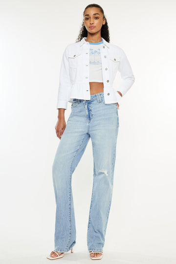 Woman wearing Kancan distressed high waist light blue straight jeans with a white cropped jacket and heels