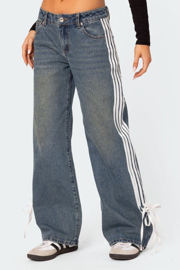 Women's side striped wide leg jeans with button closure and bow detail