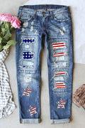 Distressed mid-rise waist straight jeans with US flag patches and star designs on blue denim