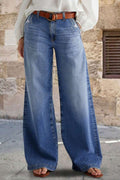 Pocketed embroidered straight leg jeans in blue denim with brown belt and casual footwear