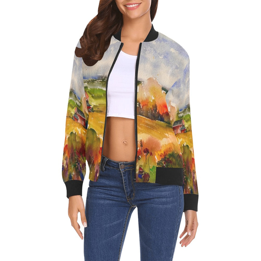 Woman wearing a countryside all over print bomber jacket with colorful rural landscape design and black ribbed collar and cuffs