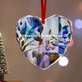 Heart-shaped crystal glass Christmas ornament by LanaArtSweden, featuring a blue festive design, customizable options, and rope for hanging.