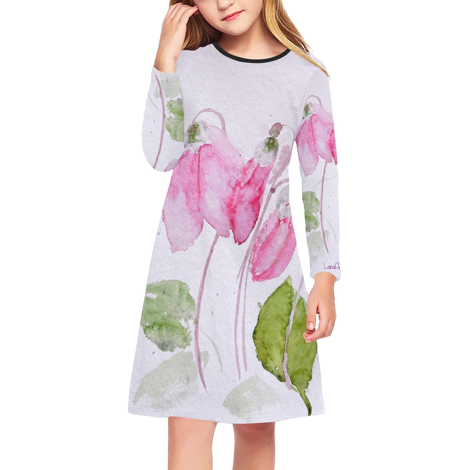 Girl wearing a long sleeve midi dress with pink cyclamen floral print on a light background, ideal for everyday summer wear.