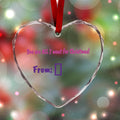 Customizable heart-shaped crystal glass ornament for Christmas, personalized with photo and holiday greeting.