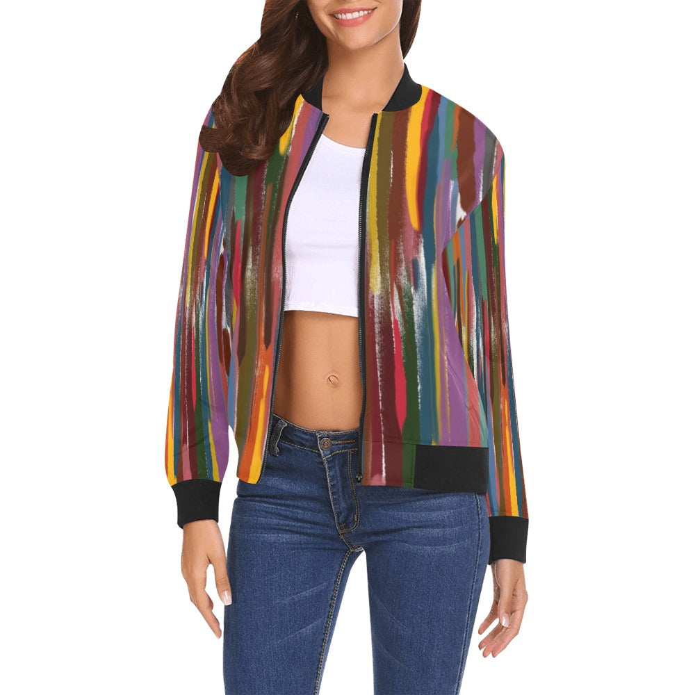 Woman wearing a colorful Ladies Power Stripes bomber jacket with vertical multicolor stripes and black ribbed collar, cuffs, and hem.