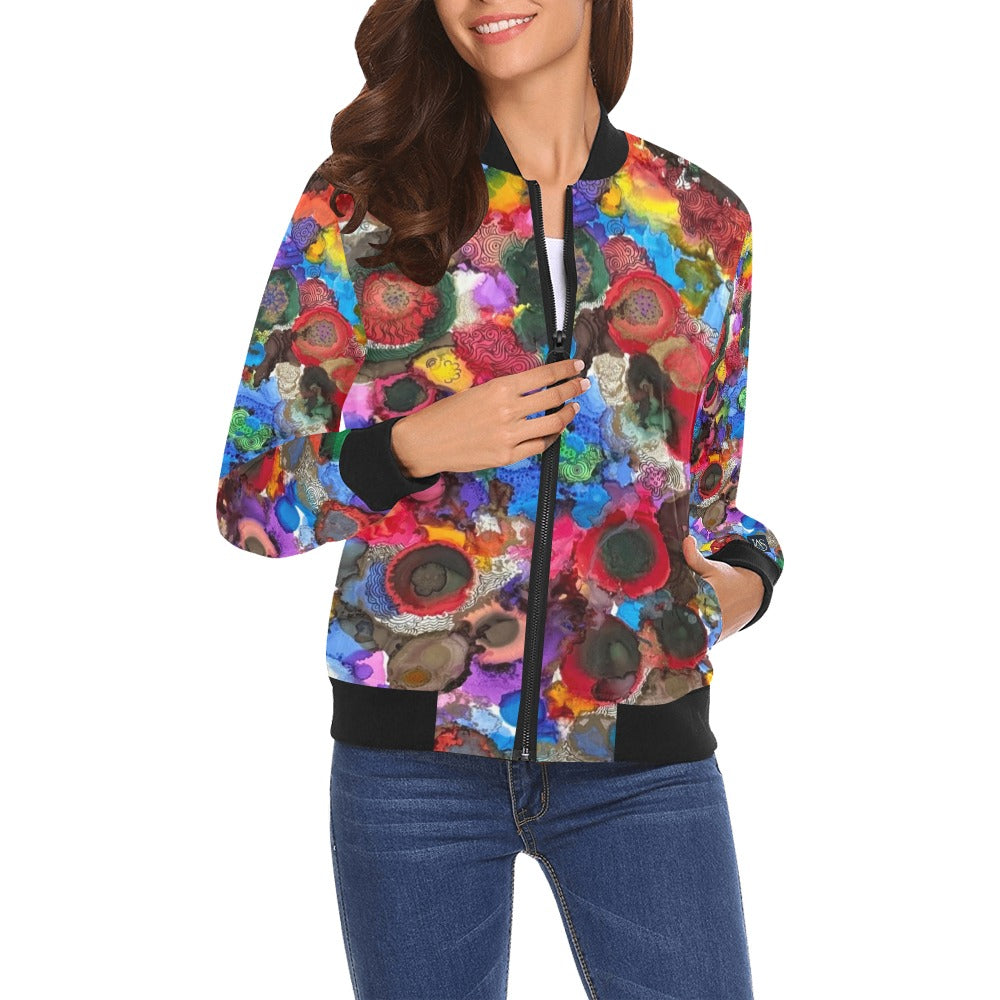 Woman wearing colorful Cosmic Blooms Bomber Jacket with ribbed collar, cuffs, and hem, styled with jeans