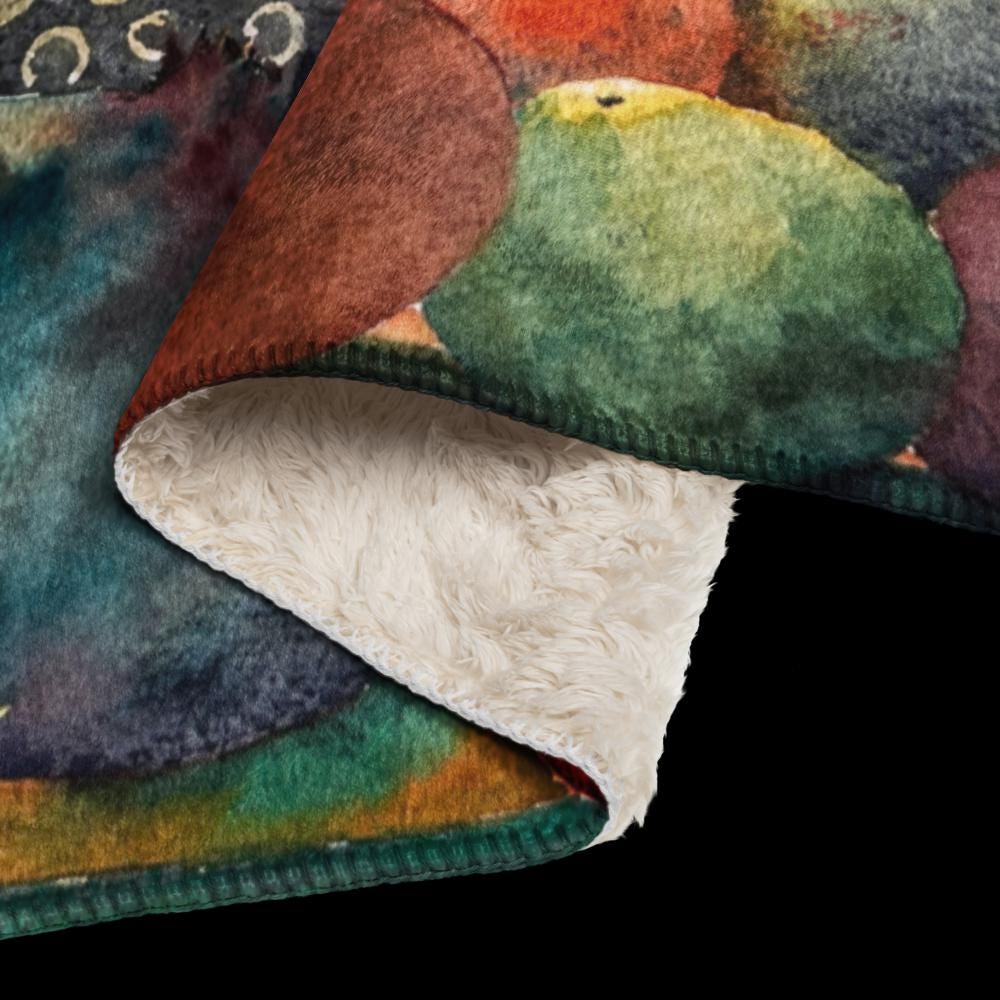 Designer sherpa throw blanket with smooth polyester surface and fluffy sherpa fabric for ultimate warmth and comfort.