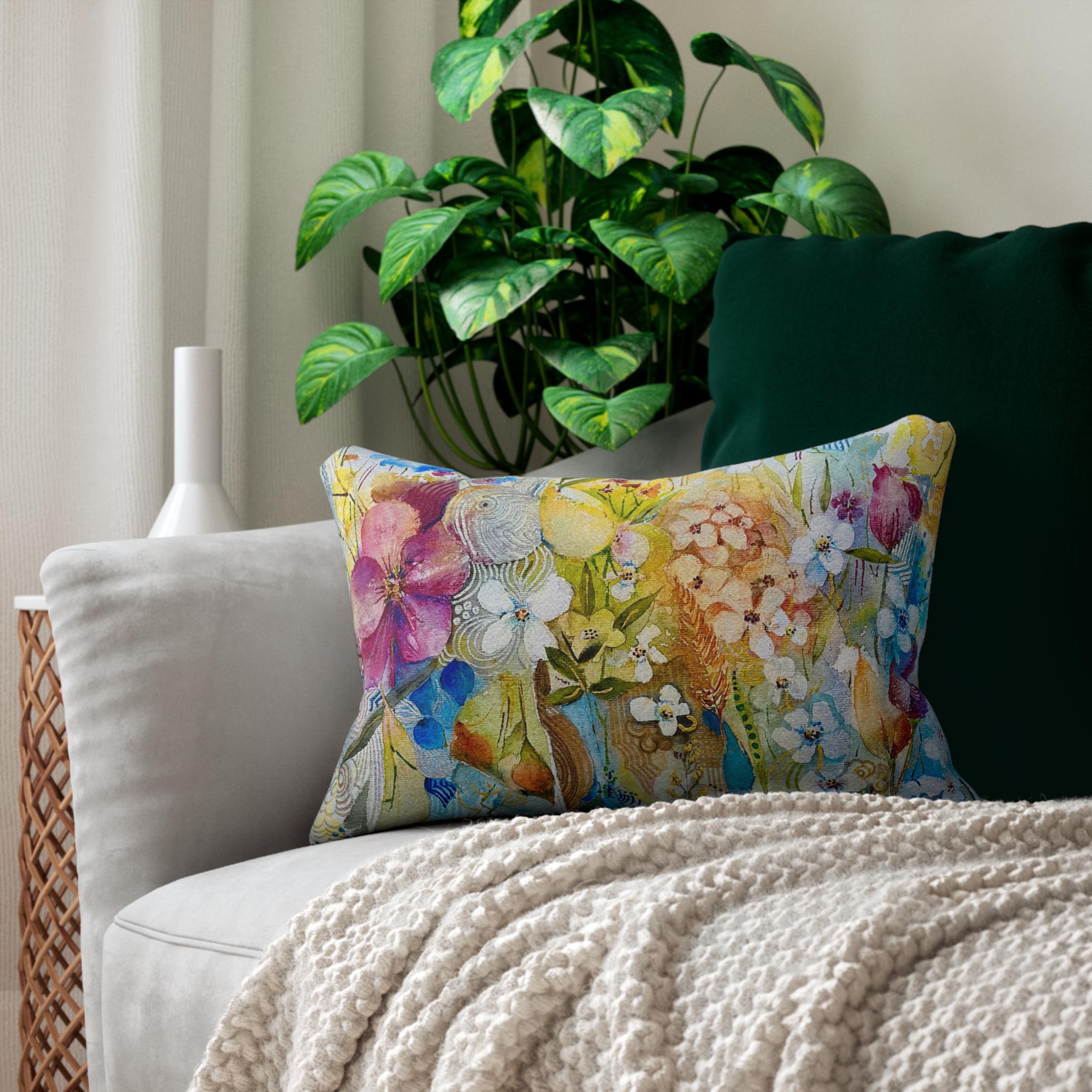 Colorful lumbar pillow case with floral original artwork, spun polyester fabric, double-sided print, and concealed beige zipper on a sofa