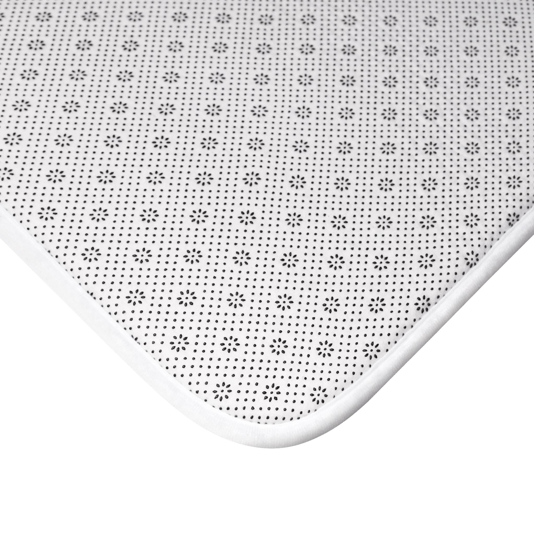 Close-up of LanaArtSweden Colorful and Elegant Bath Mat corner showing anti-slip backing with dotted pattern and white binding edge